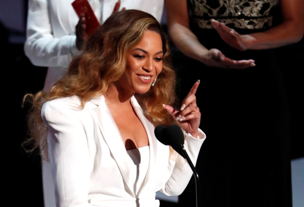 Beyonce reacts after winning the entertainer of the year award. REUTERS/Mario Anzuoni
