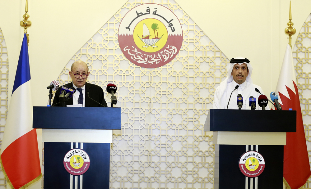 Deputy Prime Minister and Minister of Foreign Affairs H E Sheikh Mohammed bin Abdulrahman Al Thani with his French counterpart Jean-Yves Le Drian during a joint press conference, yesterday.  PIC: RAJAN VADAKKEMURIYIL