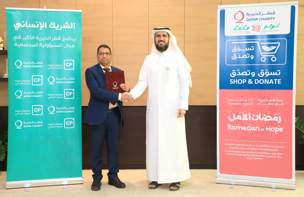 CEO’s Assistant for the Resources Development and Media sector at Qatar Charity Ahmad Yousef Fakhroo, and Regional Manager of Lulu Hypermarket Qatar Shanavas Padiyath during the signing ceremony.