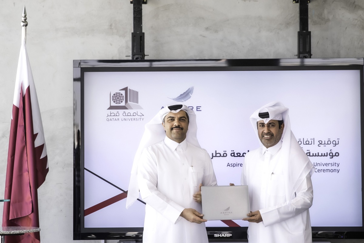 Aspire Logistics Director-General Abdulla Nasser Al Naemi and Qatar University Head of Strategy and Development, Dr. Khaled Al Khanji, after signing the agreement.