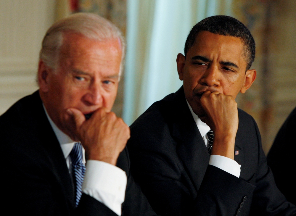 Then-U.S. President Barack Obama (R) and Vice President Joe Biden participate in a cabinet meeting at the White House in Washington, U.S., June 8, 2009. REUTERS/Jason Reed/File Photo