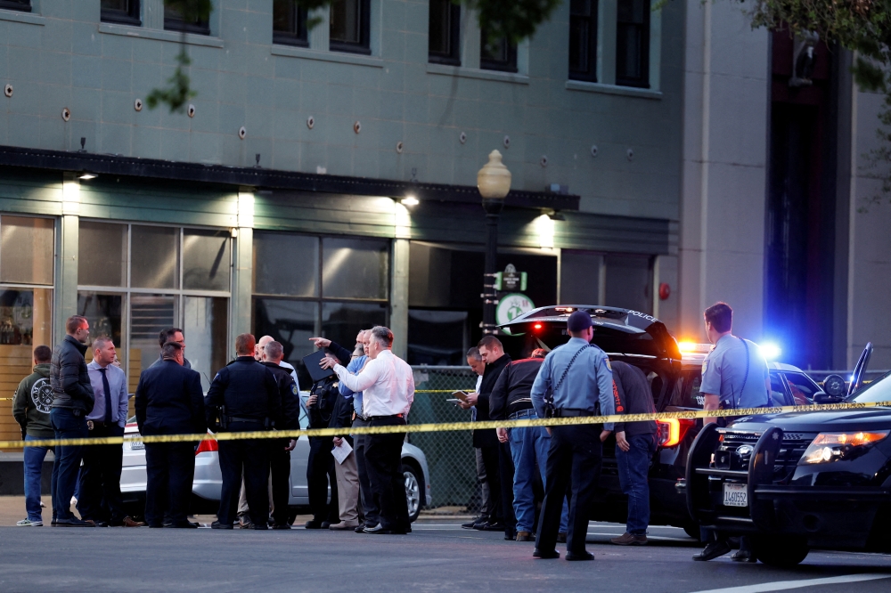 Police are seen after an early-morning shooting in a stretch of the downtown near the Golden 1 Center arena in Sacramento, California, U.S. April 3, 2022. REUTERS/Fred Greaves