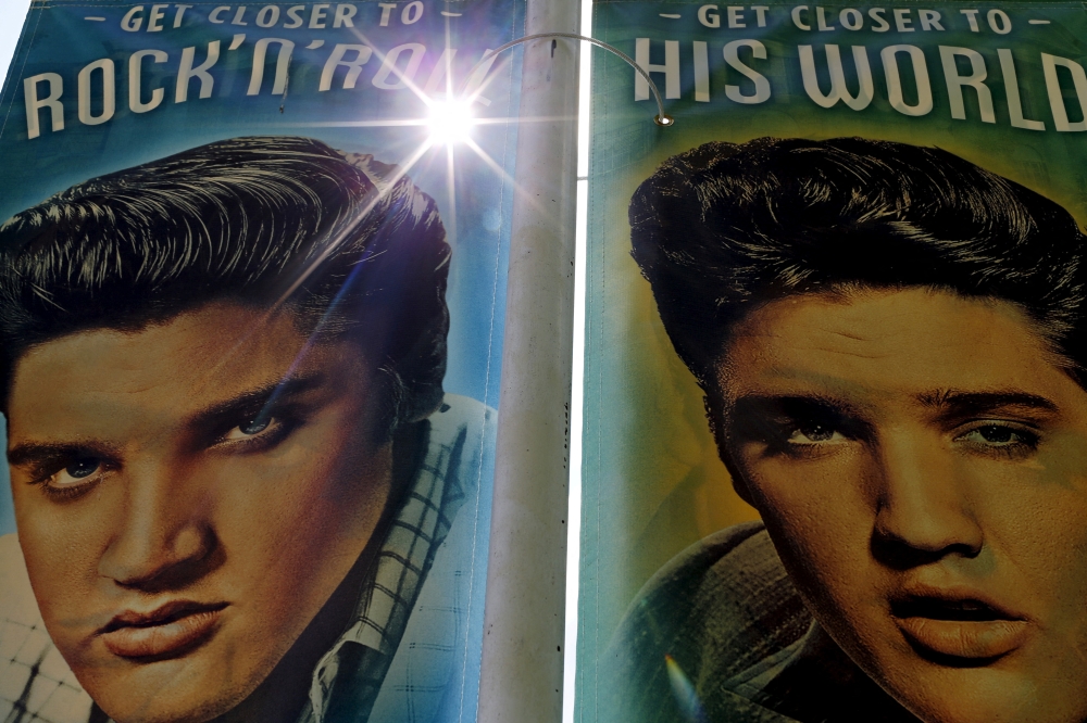 Street banners line Elvis Presley boulevard near Graceland in Memphis, Tennessee, May 28, 2015. The estate that was home to Elvis Presley receives over 600,000 visitors a year and was declared a National Historic Monument in 2006. REUTERS/Mike Blake/File Photo