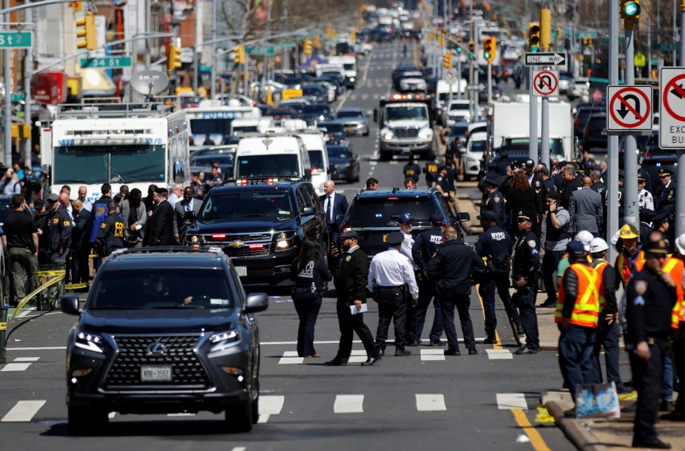 Emergency personnel work at the scene of a shooting at a subway station in the Brooklyn borough of New York City, New York, U.S., April 12, 2022. REUTERS/Eduardo Munoz