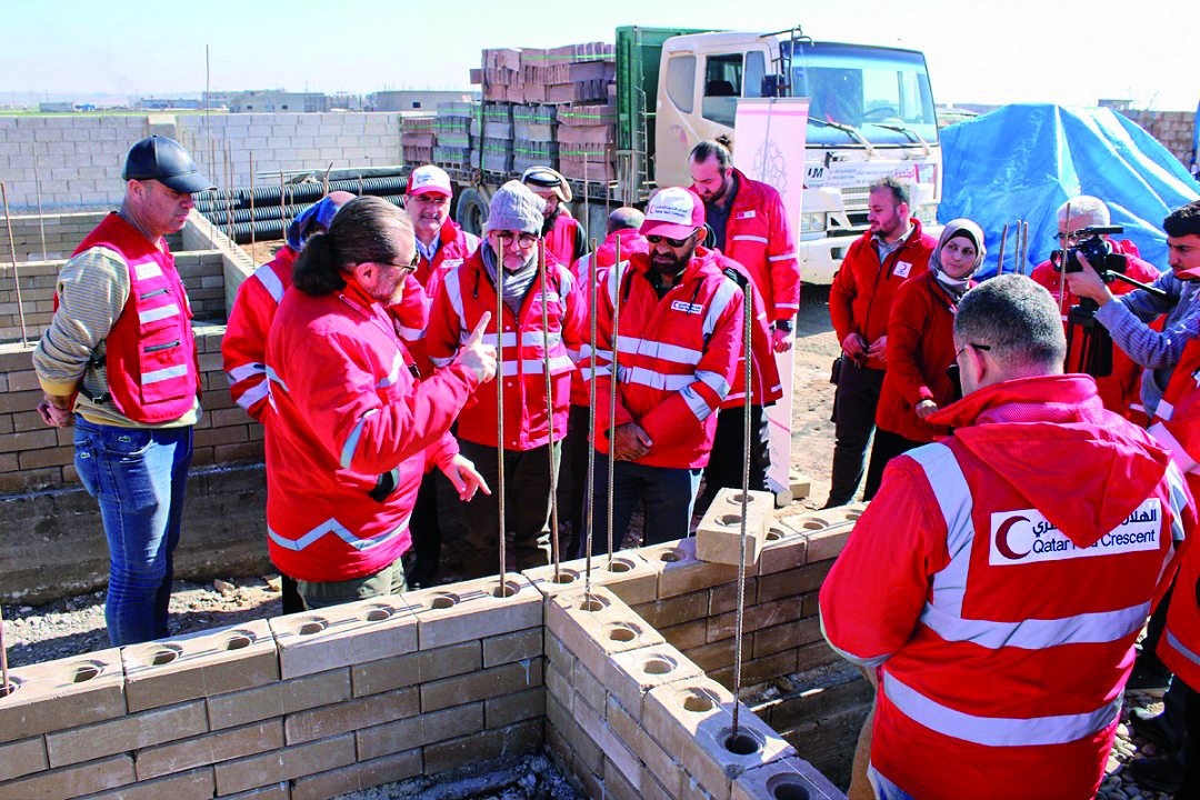 QRCS’s representation mission replacing the damaged tents with new ones.