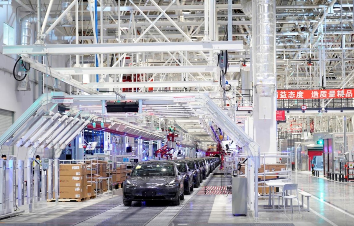 FILE PICTURE: Tesla China-made Model 3 vehicles are seen during a delivery event at its factory in Shanghai, China Jan. 7, 2020. REUTERS/Aly Song/File Photo

