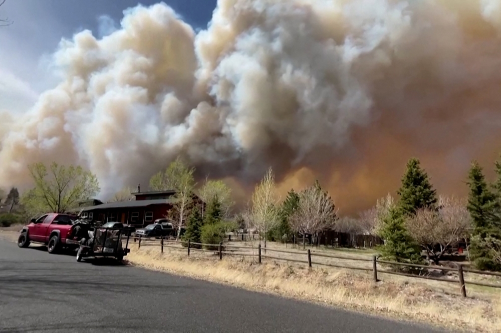 Smoke drifts from the Tunnel Fire north of Flagstaff, Arizona April 19, 2022 in a still image from video. Image taken April 19, 2022. REUTERS/Reuters TV