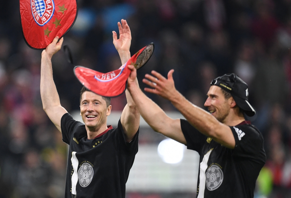 Bayern Munich's Leon Goretzka and Robert Lewandowski celebrate after winning the Bundesliga REUTERS/Andreas Gebert 
