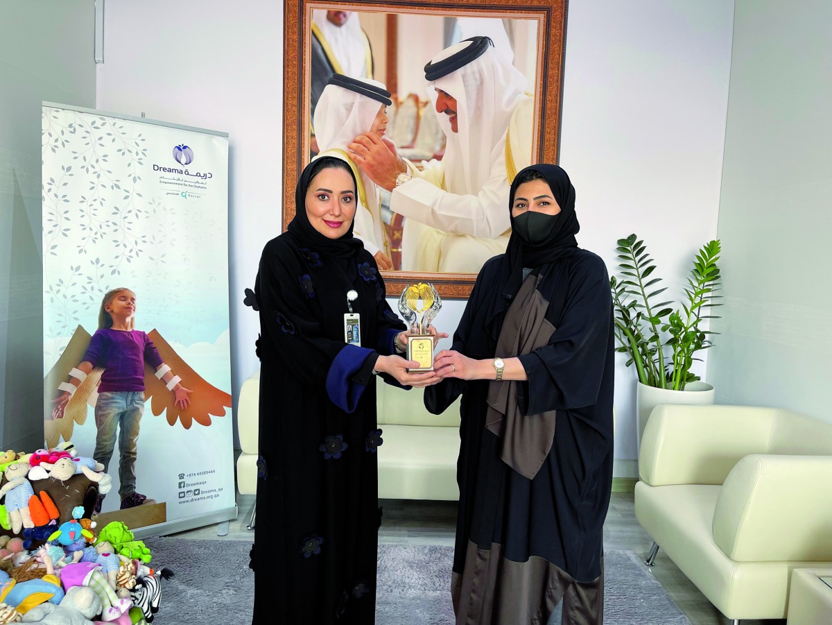 Dreama and Masraf Al Rayan officials during an event. 