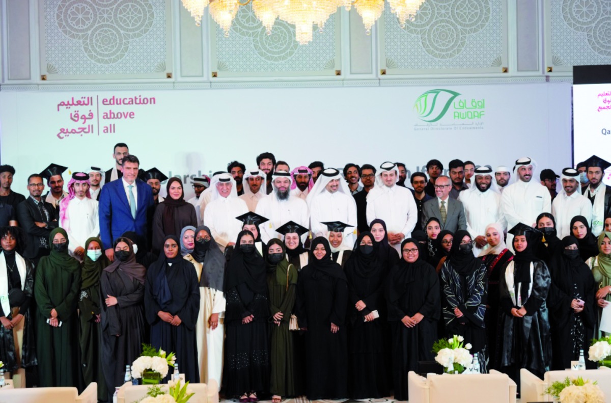 Director of General Department of Endowments Dr. Sheikh Khalid bin Mohammed bin Ghanem Al Thani and other officials with graduating students and new recipients of Qatar Scholarship Programme. 