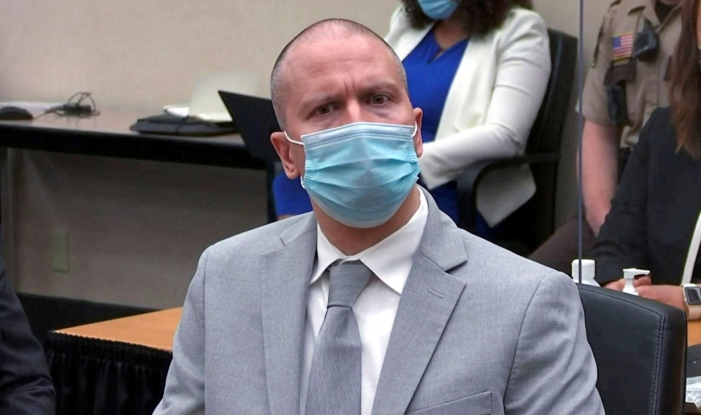 Former Minneapolis police officer Derek Chauvin reacts as he listens to the judge announce his sentence of twenty two and a half years in prison for murder in the death of George Floyd in Minneapolis, Minnesota, U.S. June 25, 2021 in a still image from video. Pool via REUTERS/File Photo