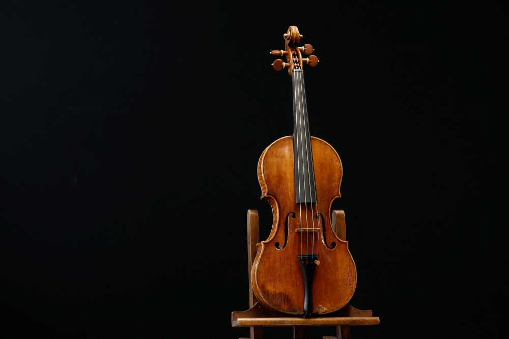 A rare 1736 violin by Italian luthier Guarneri del Gesu is displayed during a media preview at Aguttes auction house ahead of the violin's auction in Neuilly-sur-Seine, near Paris, France, April 26, 2022. REUTERS/Benoit Tessier
 