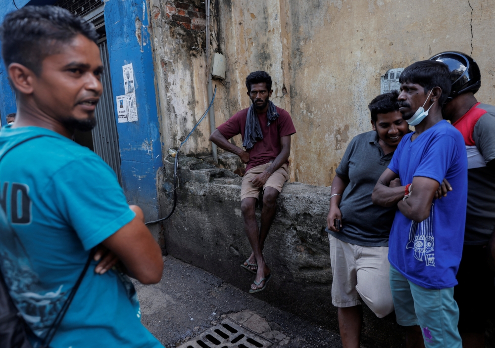 Workers are seen at a closed essential food store during a nationwide strike demanding the resignation of President Goatabaya Takapaksa and his cabinet in Colombo, Sri Lanka, April 28, 2022. Reuters/Dinuka Liyanawatte