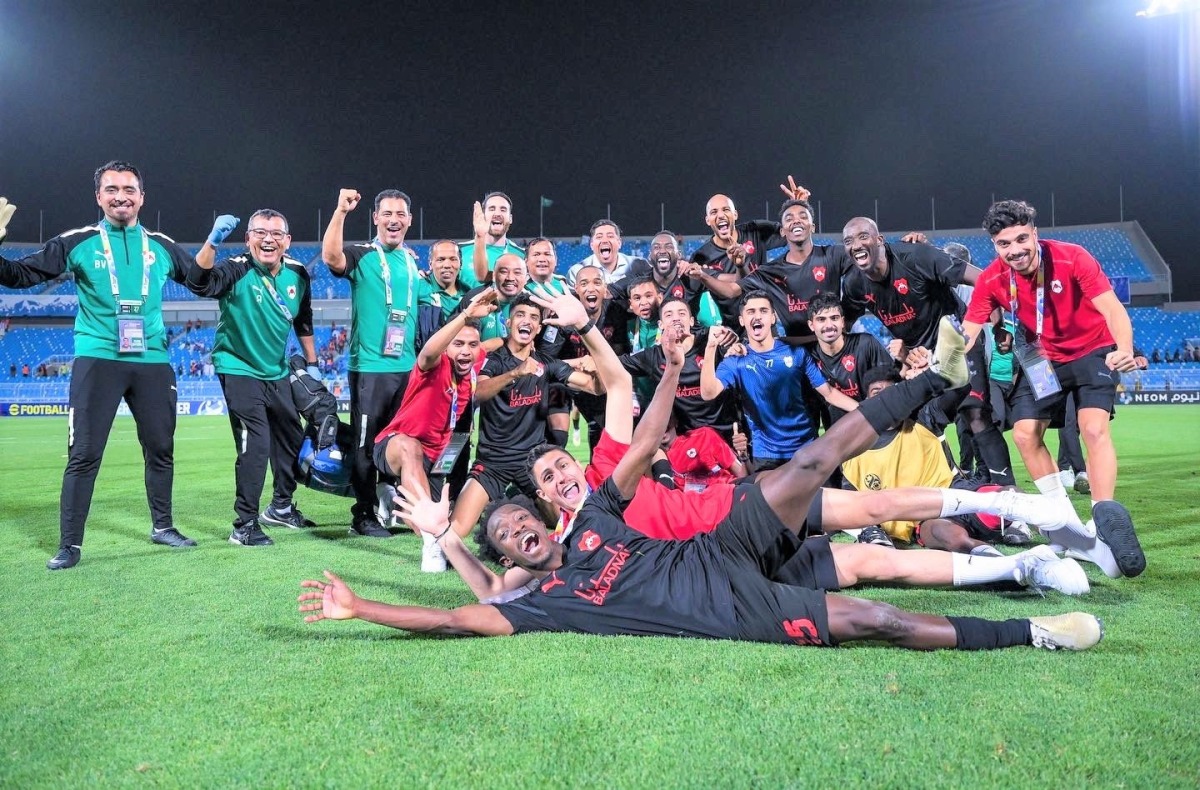 Al Rayyan’s players and officials celebrate after win over Al Hilal.