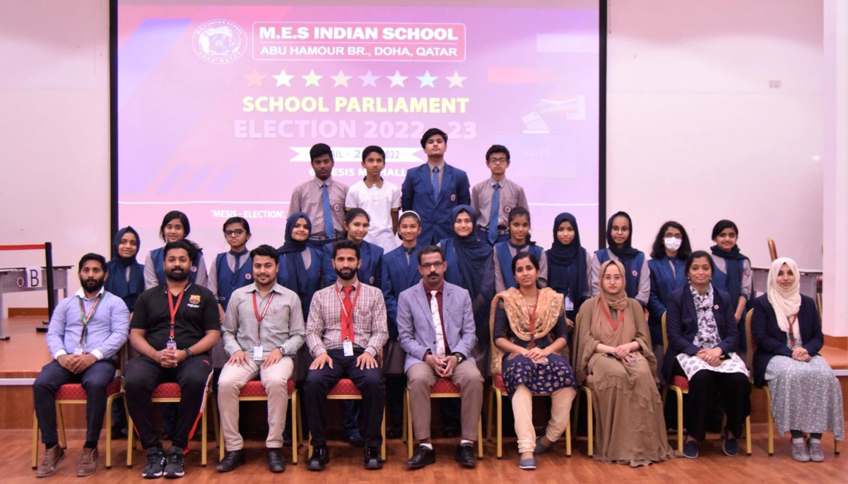 The elected students with school officials.
