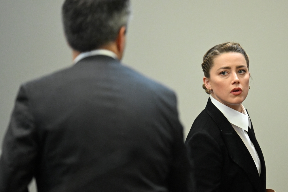 Actor Amber Heard looks stands in the courtroom at Fairfax County Circuit Court during a defamation case against her by actor Johnny Depp, her ex-husband, in Fairfax, Virginia, U.S., May 3, 2022. Jim Watson/Pool via REUTERS