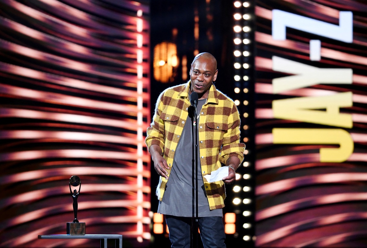 FILE PHOTO: Dave Chappelle introduces Jay-Z during the Rock and Roll Hall of Fame induction ceremony in Cleveland, Ohio, U.S. October 30, 2021. REUTERS/Gaelen Morse/File Photo
