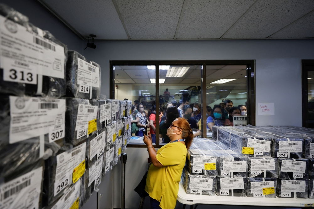 A teacher verifies ballots at the Makati City Hall ahead of the 2022 national elections in Metro Manila, Philippines, May 6, 2022. REUTERS/Willy Kurniawan