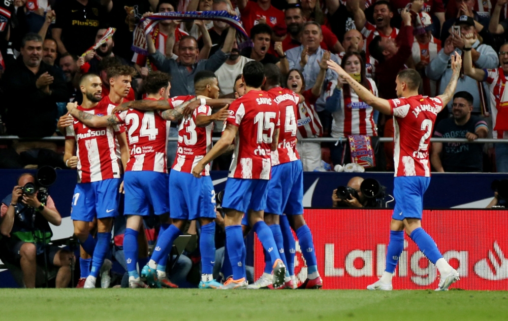 Atletico Madrid's Yannick Carrasco celebrates scoring their first goal with teammates REUTERS/Isabel Infantes
