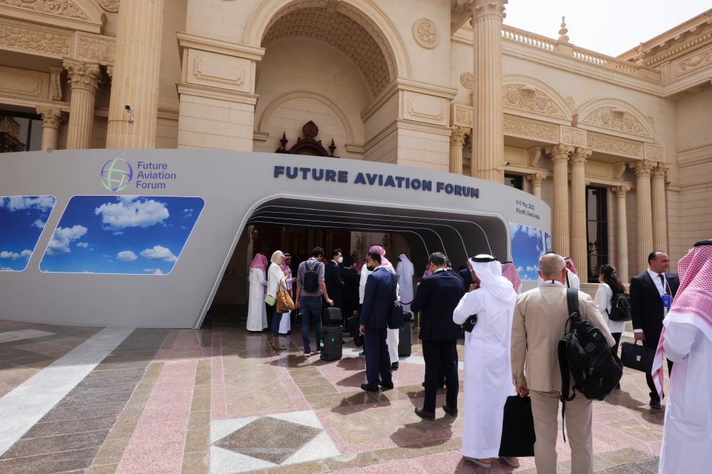 Visitors line up at the security check point as they arrive to attend the Future Aviation Forum in Riyadh, Saudi Arabia, May 9, 2022. REUTERS.