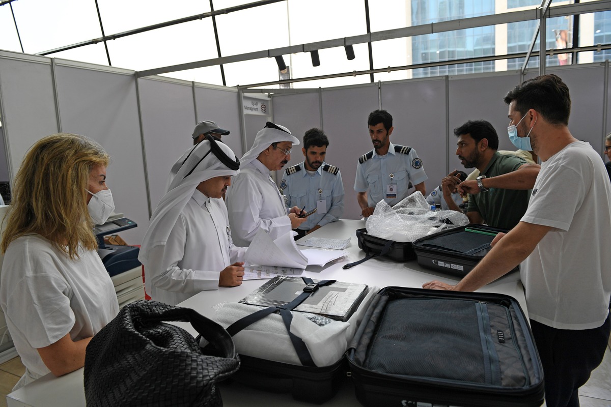 Custom officials dealing with exhibitors.