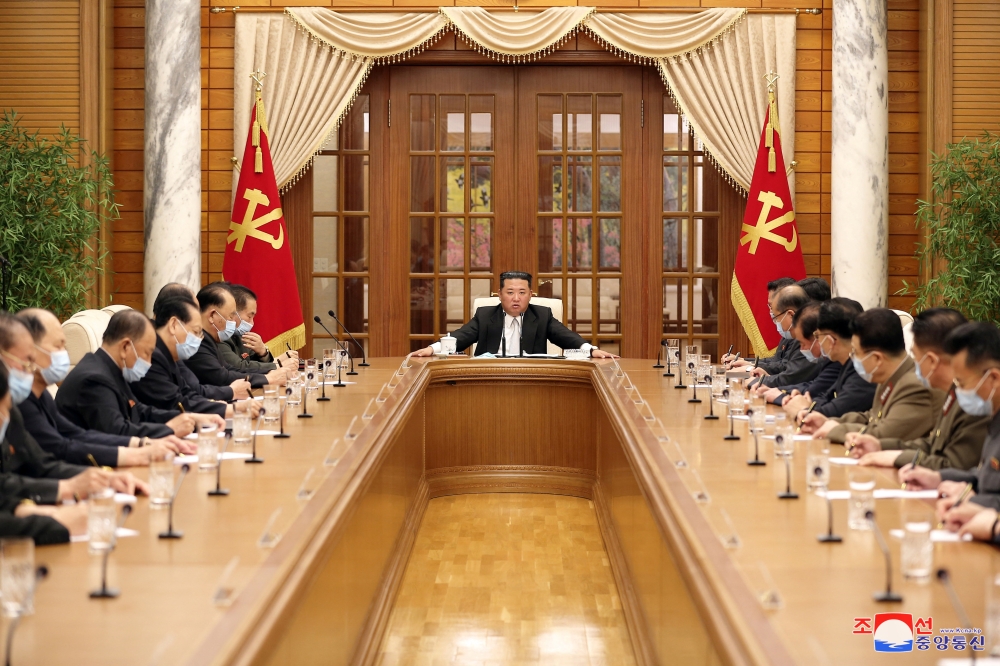 North Korean leader Kim Jong Un chairs a Worker's Party meeting on coronavirus disease (COVID-19) outbreak response in this undated photo released by North Korea's Korean Central News Agency (KCNA) on May 12, 2022. KCNA via REUTERS