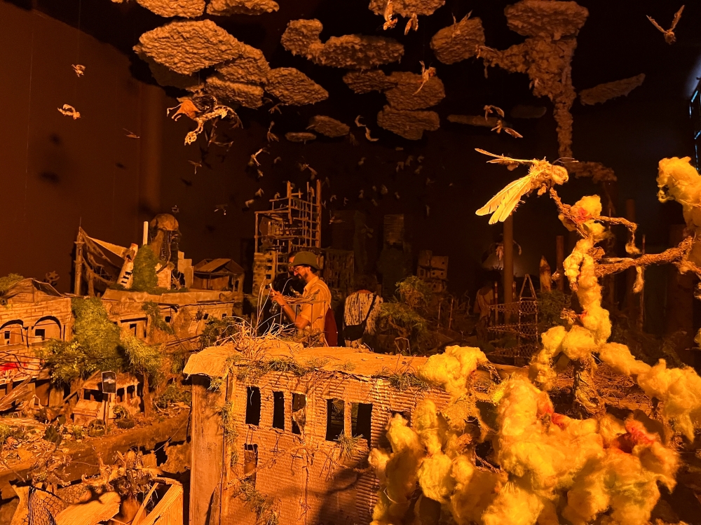 A visitor takes pictures of art installations during the 14th edition of Senegal's Biennale of African Contemporary Art, in Dakar, Senegal, May 19, 2022. Picture taken May 19, 2022. REUTERS/Elodie Toto