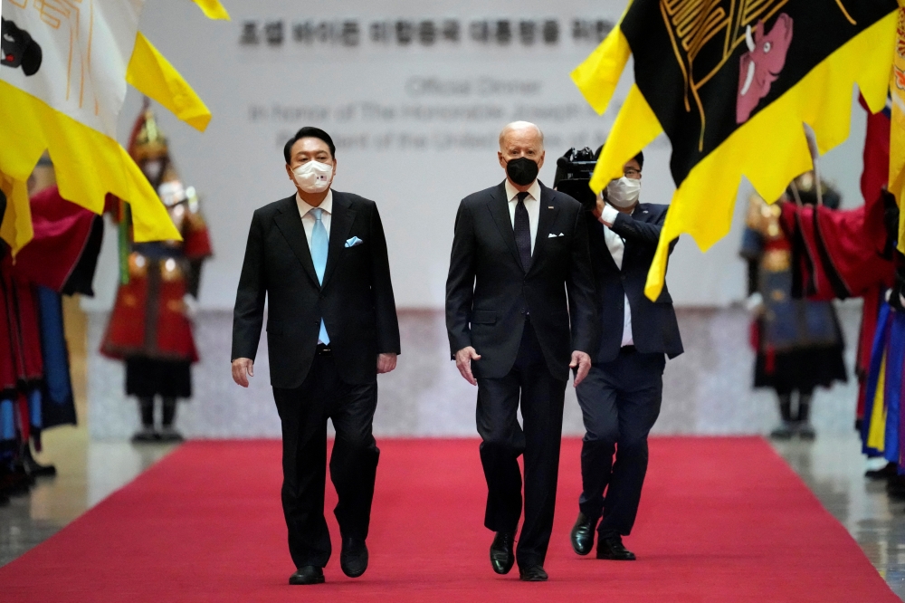 US President Joe Biden and South Korean President Yoon Suk-yeol arrive for a state dinner at the National Museum of Korea, in Seoul, South Korea, May 21, 2022. Lee Jin-man/Pool via Reuters