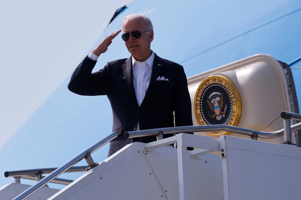 U.S. President Joe Biden gestures as he leave the Osan Air Base in Pyeongtaek, South Korea, May 22, 2022. REUTERS/Jonathan Ernst