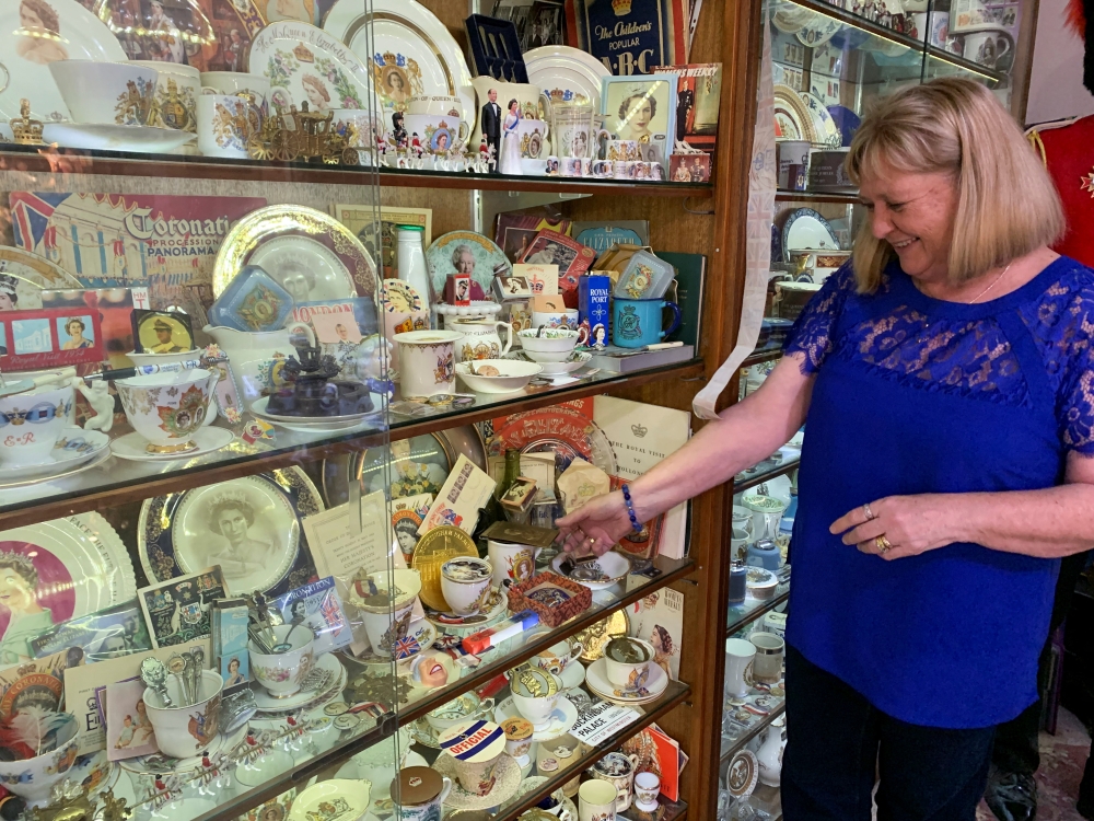 British royal family memorabilia collector Jan Hugo looks at memorabilia in one of her cabinets dedicated to Queen Elizabeth II, in Nulkaba, Australia May 4, 2022. Reuters/Stefica Nicol Bikes