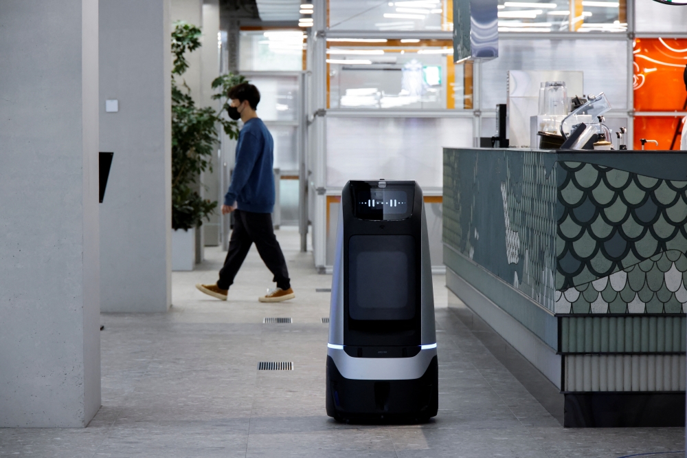 A robot using 5G network moves during a demonstration at the Naver 1784 company office in Seongnam, South Korea, May 13, 2022. Picture taken May 13, 2022. REUTERS/ Heo Ran
