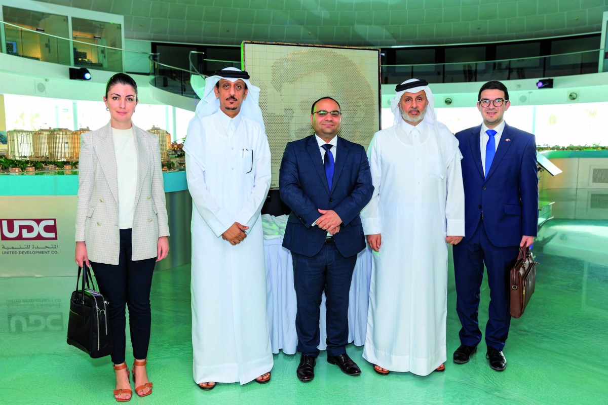 Malta’s Minister of Finance and Employment H E Clyde Caruana being received by UDC Chairman Turki bin Mohammed Al Khater, during a visit to The Pearl and Gewan Islands, recently. 