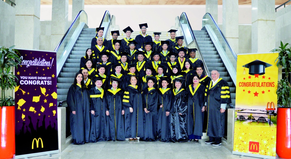 McDonald’s Qatar employees, who graduated from Leading Great Restaurant Training Course offered by Hamburger University, pose for a photograph.