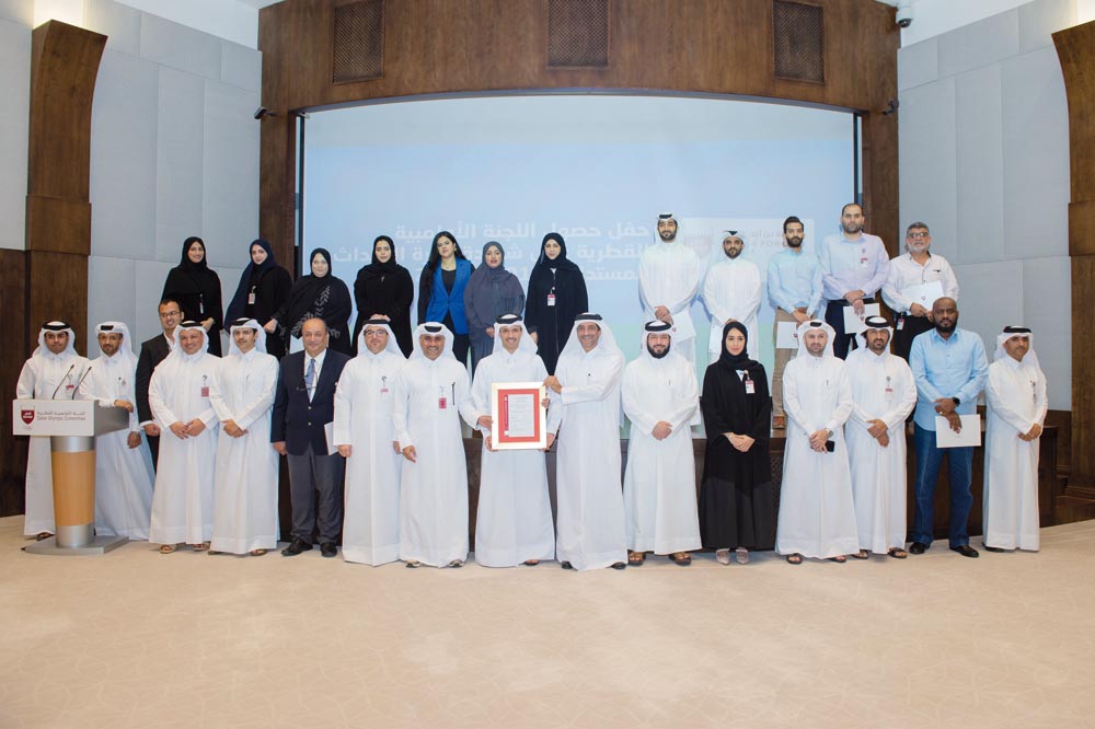 QOC Secretary General Jassim bin Rashid Al Buenain along with other officials at the ESMS award ceremony yesterday.  