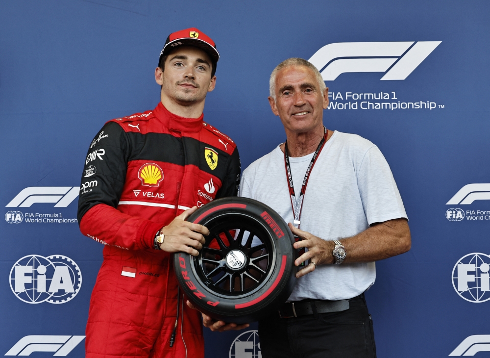 Ferrari's Charles Leclerc celebrates after winning pole position REUTERS/Hamad I Mohammed/Pool