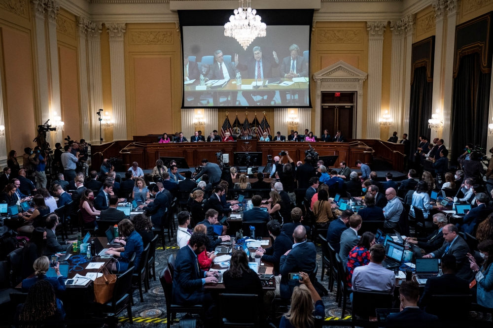 A video of former Attorney General William Barr speaking is shown on a screen as the House select committee tasked with investigating the January 6th attack on the Capitol hold a hearing on Capitol Hill, in Washington, U.S. June 13, 2022. Jabin Botsford/Pool via Reuters