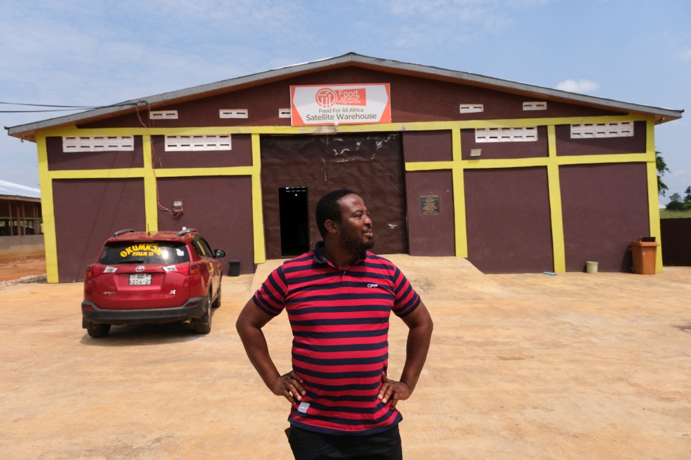 Chef Elijah Amoo Addo, 31, looks on outside the Food For All Africa satellite warehouse in Offinso, Ashanti Region, Ghana June 7, 2022. Reuters/Francis Kokoroko