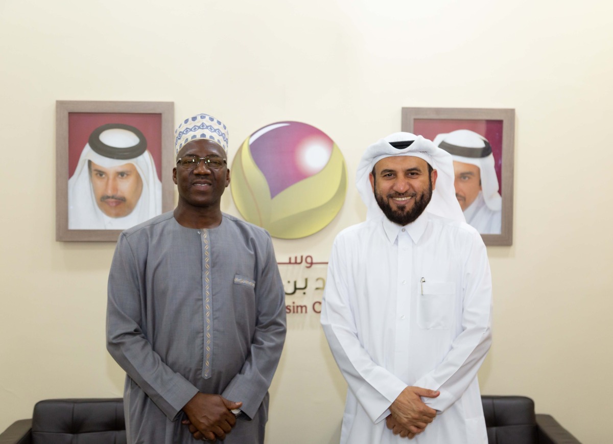 Mr. Saeed Muthaker Al-Hajri, CEO of Jassim and Hamad bin Jassim Charitable Foundation receiving HE Foday Mulang, Gambian ambassador to the State of Qatar at the Foundation’s headquarters, during the meeting. 