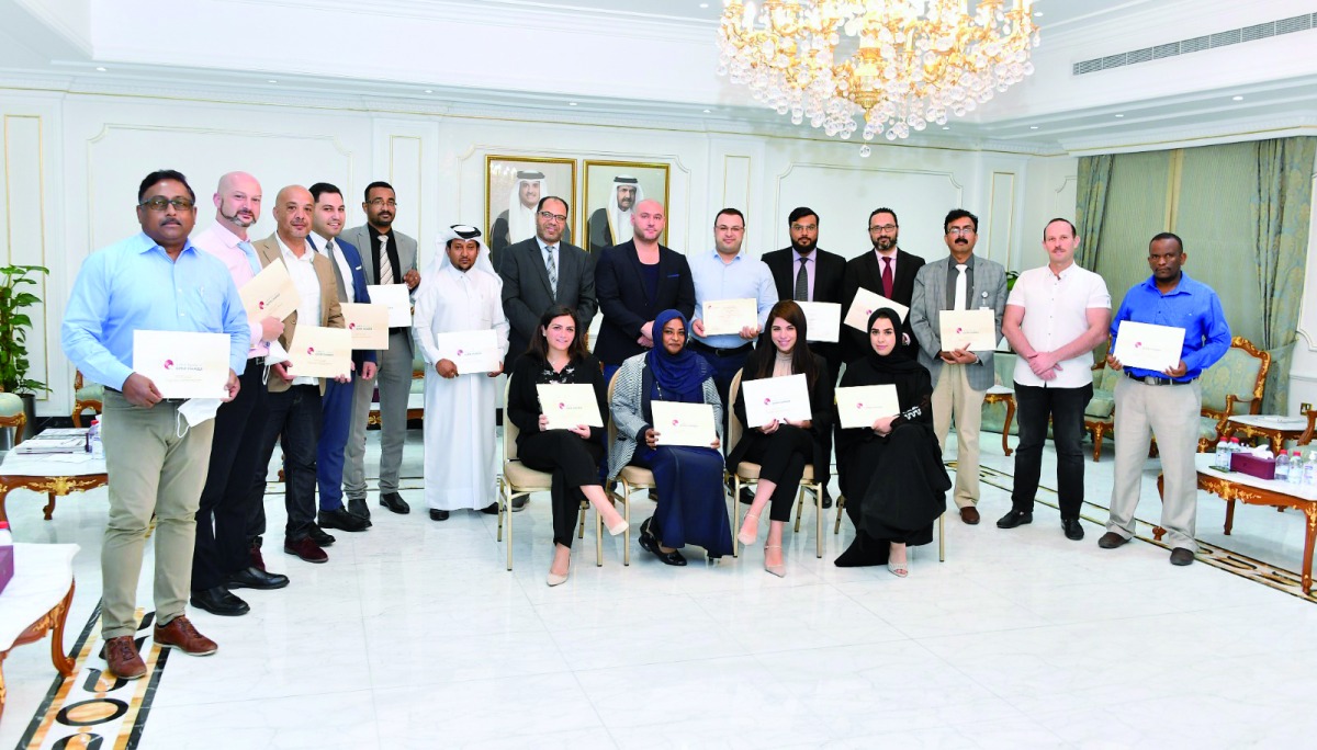 Participants with their certificates of course completion at the Qatar Chambers headquarters, in Doha, recently. 