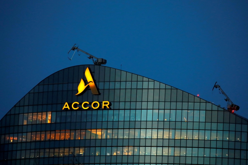 The logo of French hotel operator AccorHotels is seen on top of the company's headquarters in Issy-les-Moulineaux near Paris, France, February 17, 2021. REUTERS/Gonzalo Fuentes/File Photo