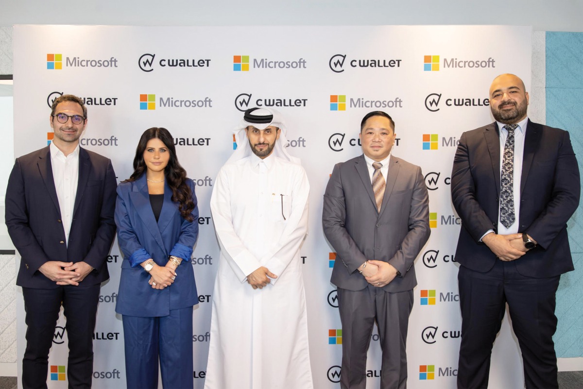 Lana Khalaf, General Manager of Microsoft Qatar, Michael Javier, CEO and Founder of CWallet, and other officials, during the agreement signing ceremony, recently. 