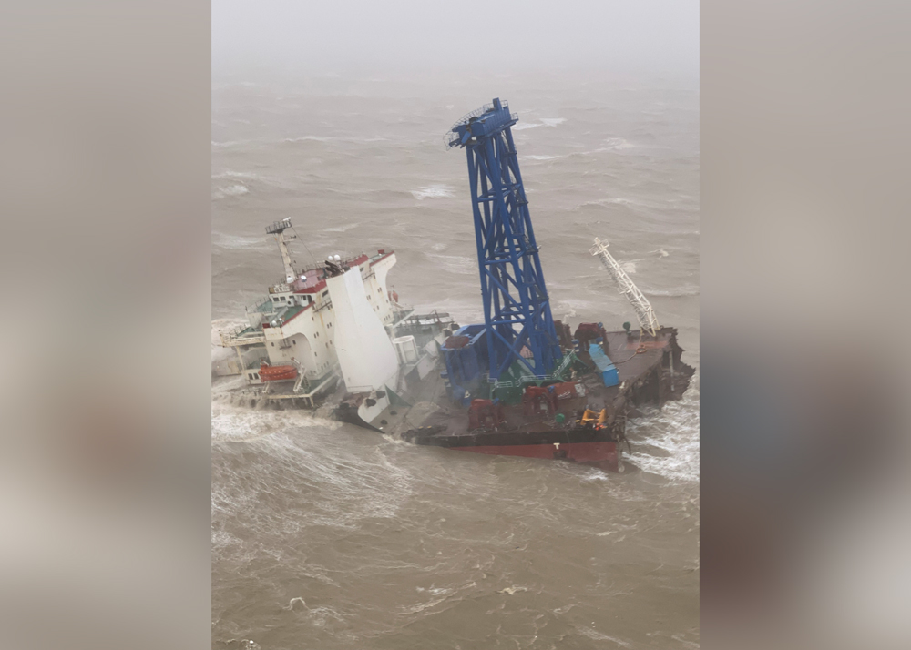 A vessel is seen sinking after it snapped in two as tropical storm Chaba passed through, according to authorities, in waters off Hong Kong, China July 2, 2022. Hong Kong Government Flying Service/Handout via REUTERS

