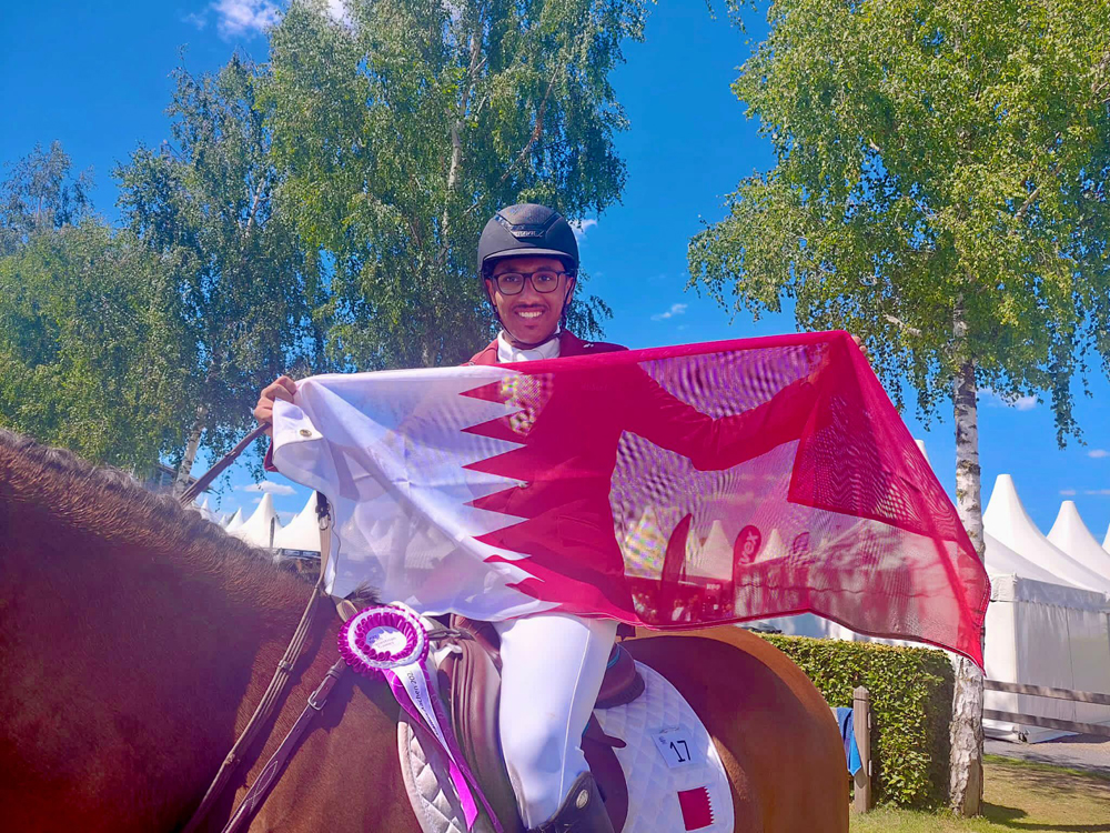 Qatari rider Saad Ahmed Al Saad celebrates after finishing fourth in the event.
