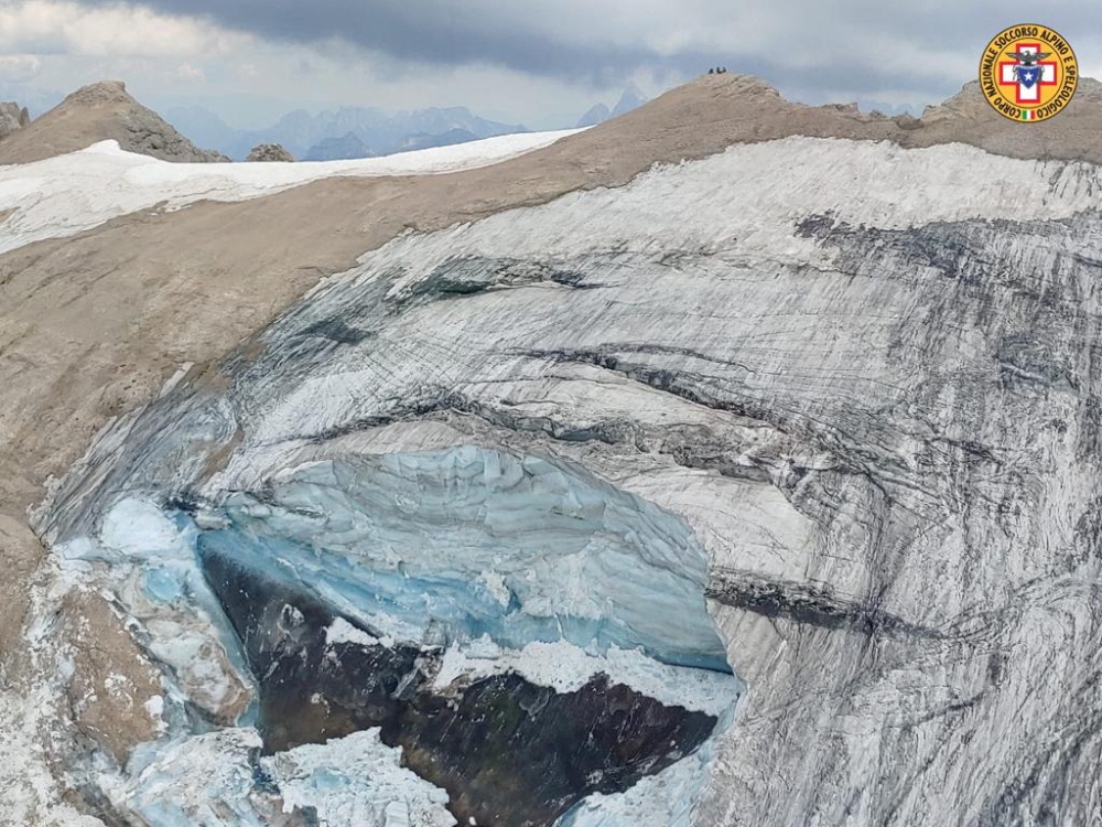 A handout photo from Alpine rescue services shows where an ice glacier collapsed on Marmolada mountain, Italy, July 3, 2022. (Reuters)

