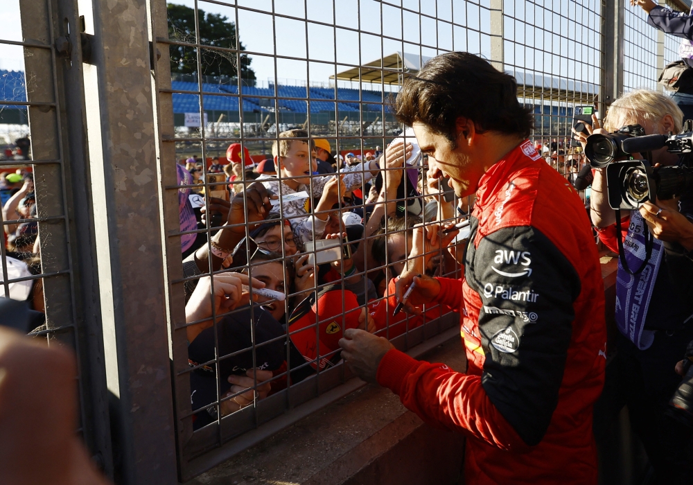 Ferrari's Carlos Sainz Jr. with fans after the race. (Reuters/Andrew Boyers)