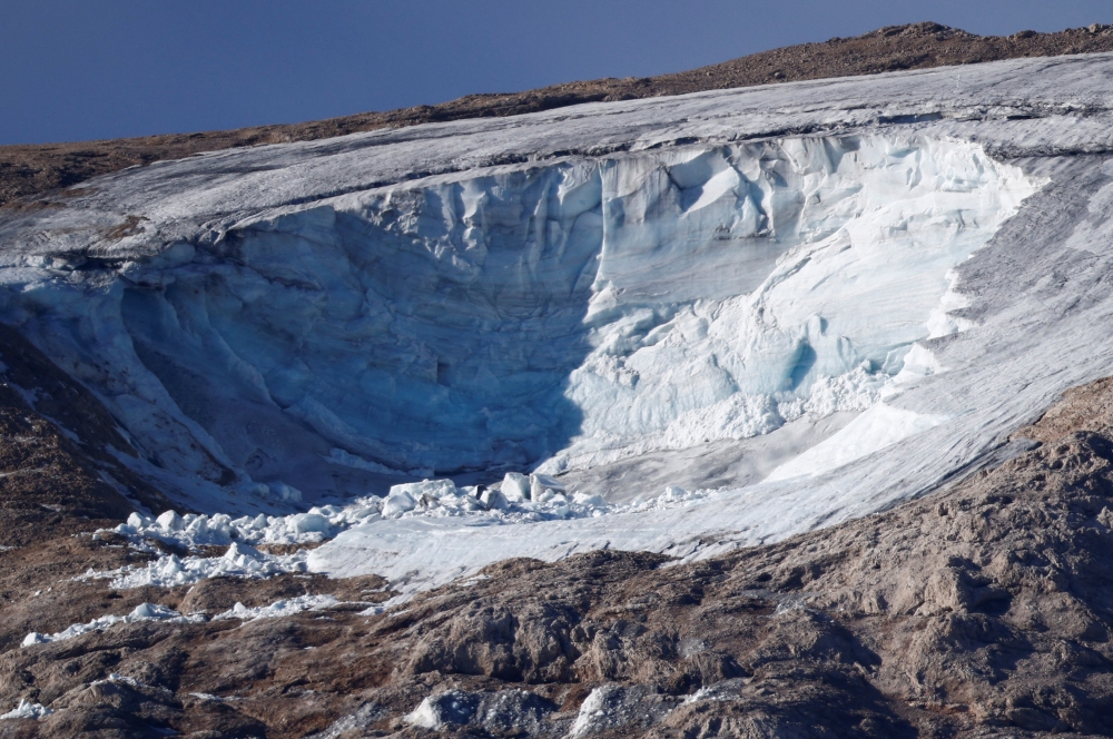 Punta Rocca summit is seen after part of a mountain glacier collapsed in the Italian Alps, at Marmolada ridge, Italy July 5, 2022. REUTERS/Guglielmo Mangiapane