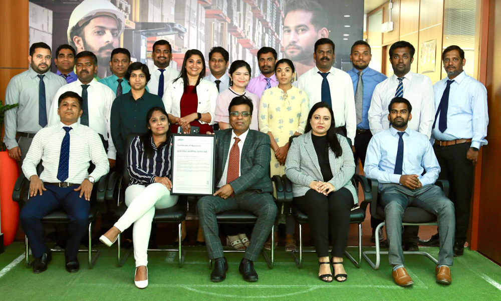 Officials posing for a group photo.