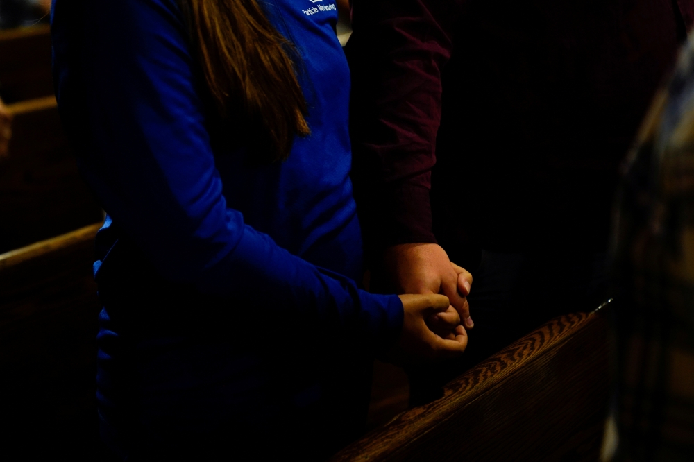 File image: Community members gather for a prayer service at Immaculate Conception Catholic Church the day after a mass shooting at a Fourth of July parade in the Chicago suburb of Highland Park, Illinois, U.S. July 5, 2022. REUTERS/Cheney Orr