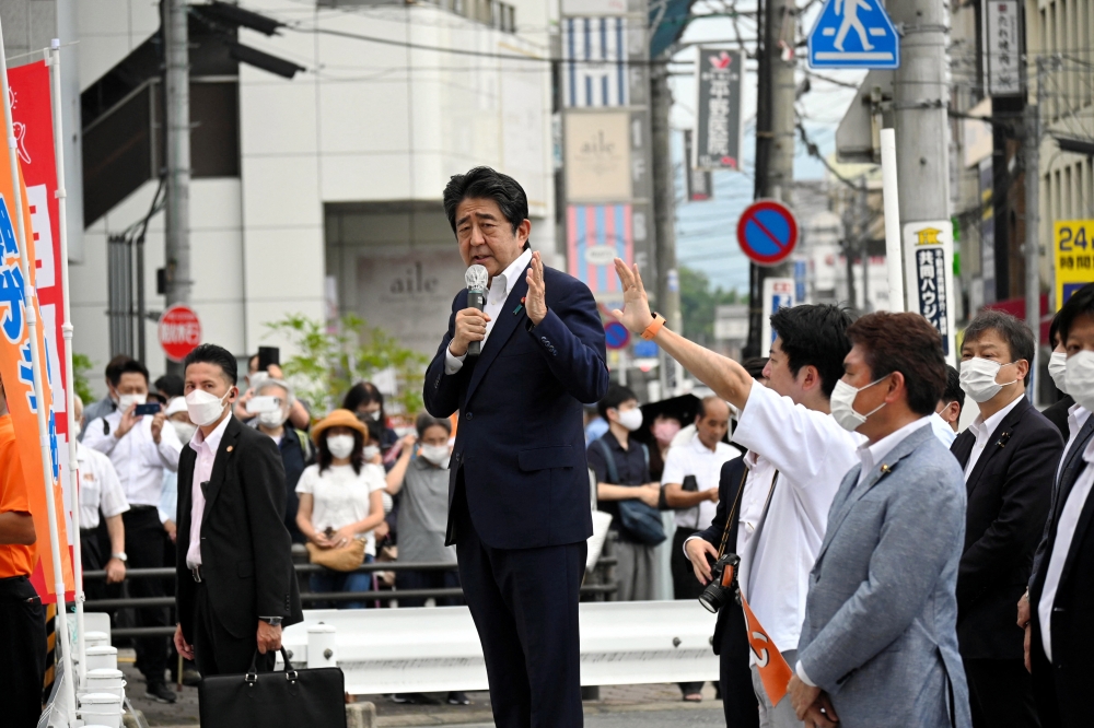 Former Japanese Prime Minister Shinzo Abe makes a speech before he was shot from behind by a man in Nara, western Japan, on July 8, 2022 in this photo taken by The Asahi Shimbun. (Reuters)

