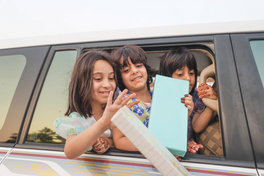  Kids enjoy receiving gifts called Eidiya at Katara.
